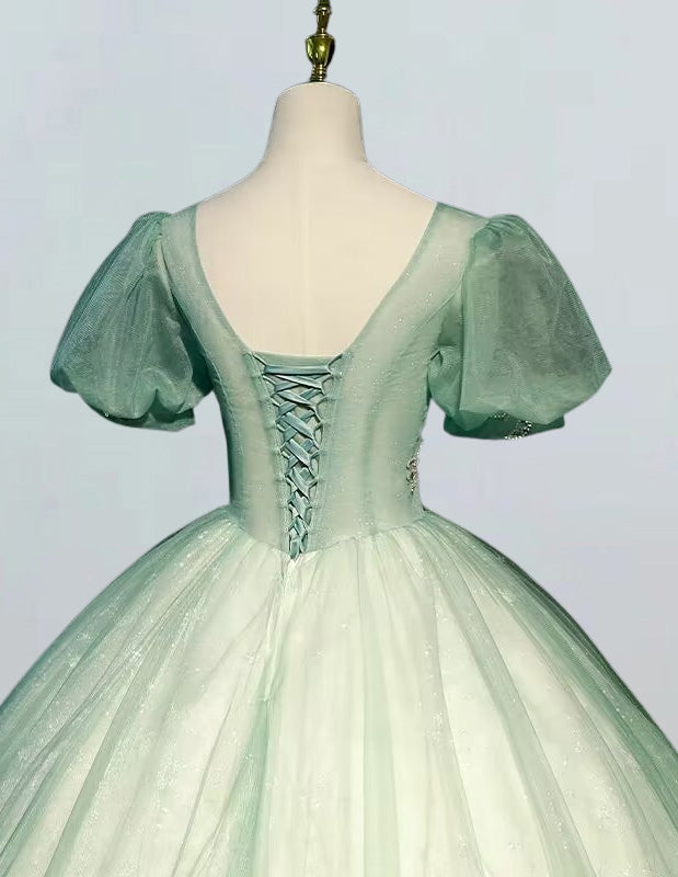 a green ball gown on a mannequin