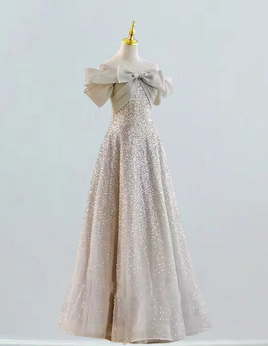 a dress on a mannequin with a bow on it