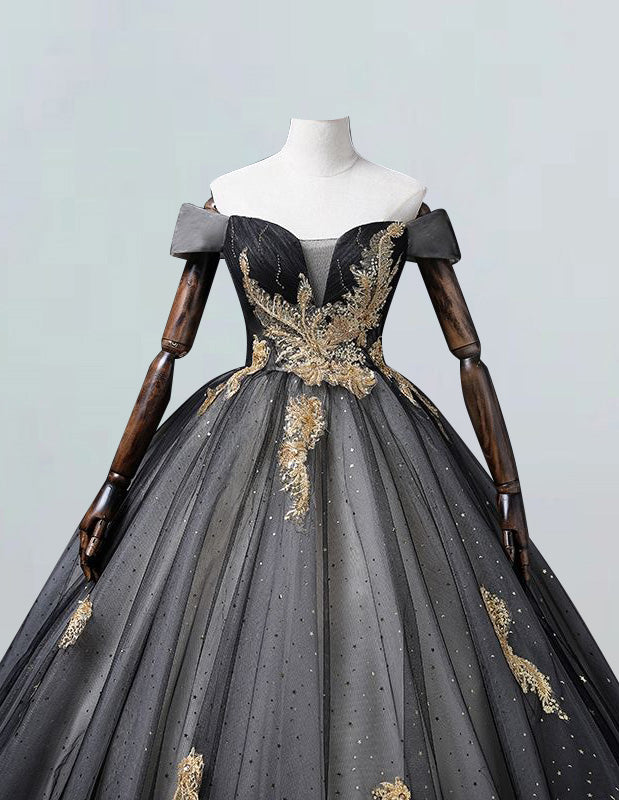 a black and gold ball gown on a mannequin