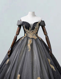 a black and gold ball gown on a mannequin