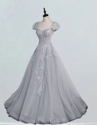 Elegant cap sleeve grey lace evening gown with sweetheart neckline, perfect for prom or as a bridesmaid dress