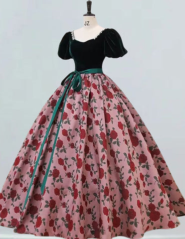 a dress on a mannequin with a green ribbon