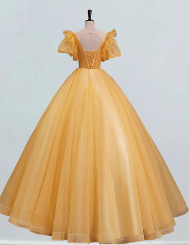 a yellow dress on a mannequin mannequin