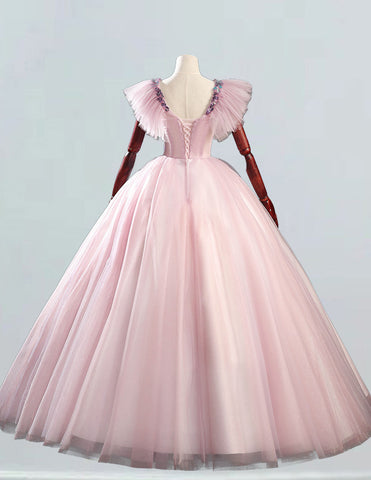 a pink ball gown on a mannequin