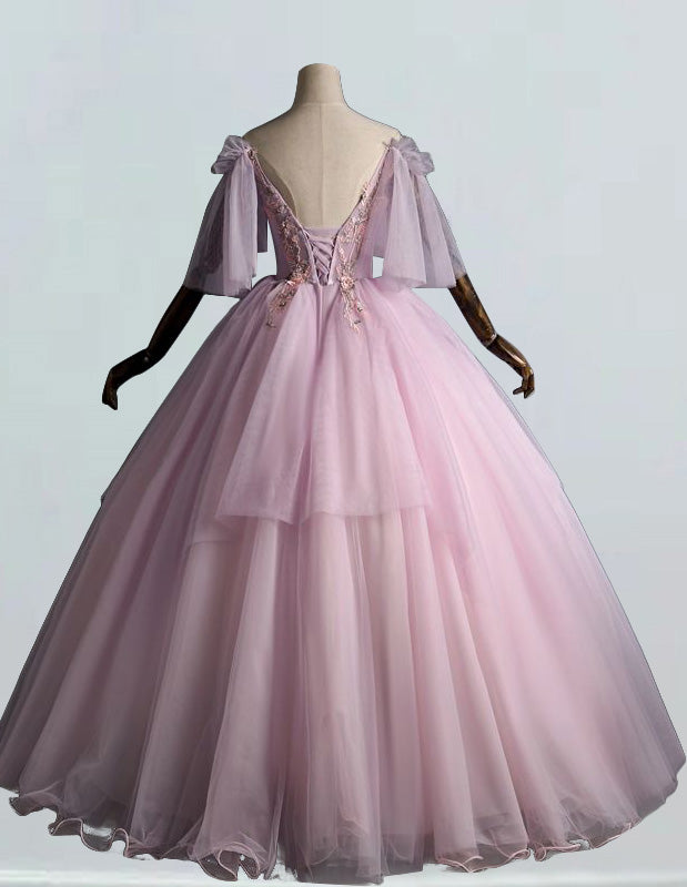 a pink ball gown on a mannequin