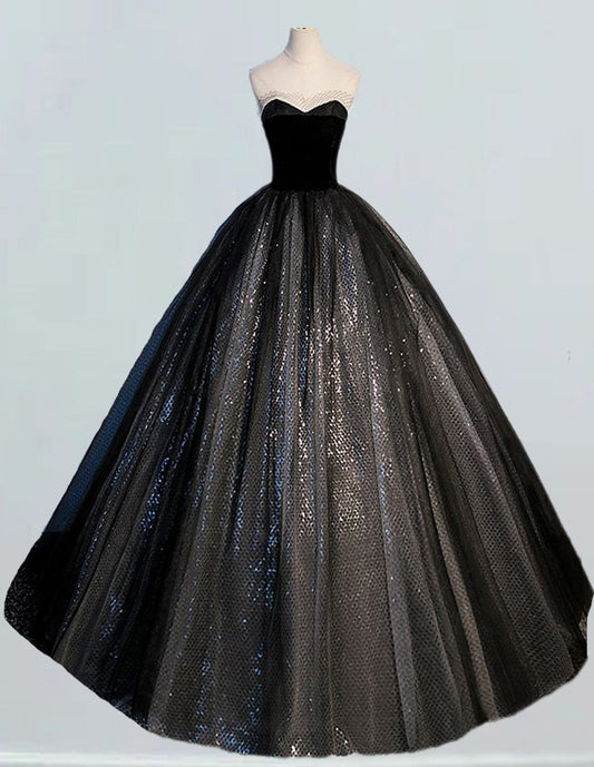 a black and silver ball gown on a mannequin