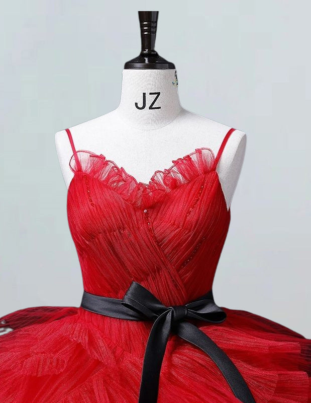 a dress on a mannequin with a black ribbon