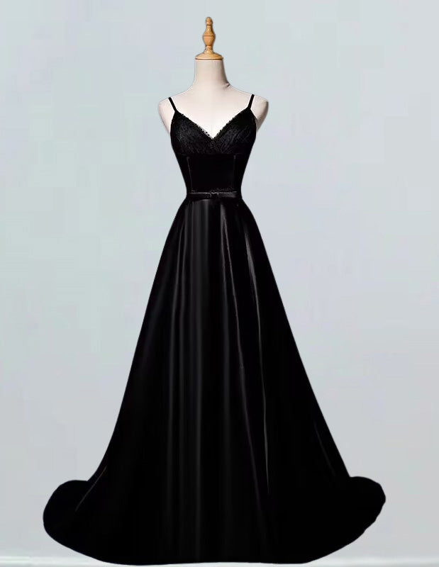 a black evening gown on a mannequin